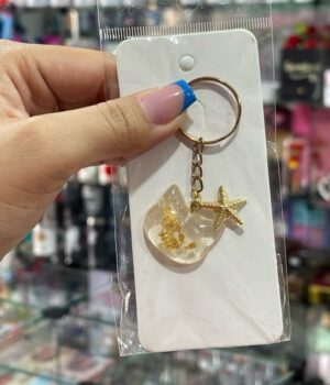 CHAVEIRO GATO TRANSPARENTE E ESTRELA DOURADA
