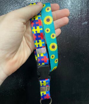 CORDÃO AUTISMO QUEBRA-CABEÇA E GIRASSOL