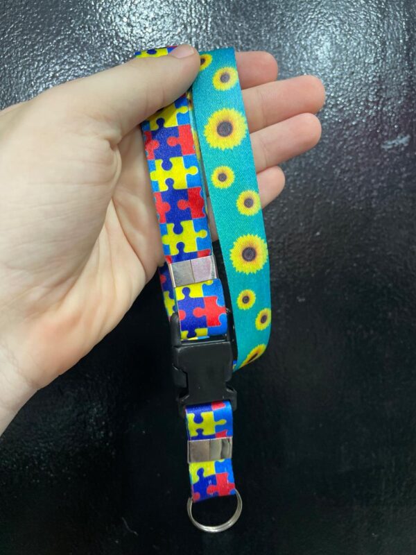 CORDÃO AUTISMO QUEBRA-CABEÇA E GIRASSOL